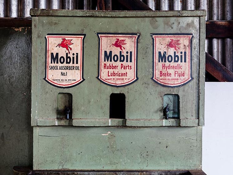 Vintage brake fluid and shock absorber oil dispenser at Corney's Garage in Hartley Historic Site.