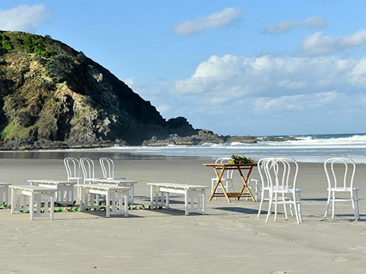 Chairs and benches set up for a wedding at Cosy Corner at Tallow Beach, Cape Byron State