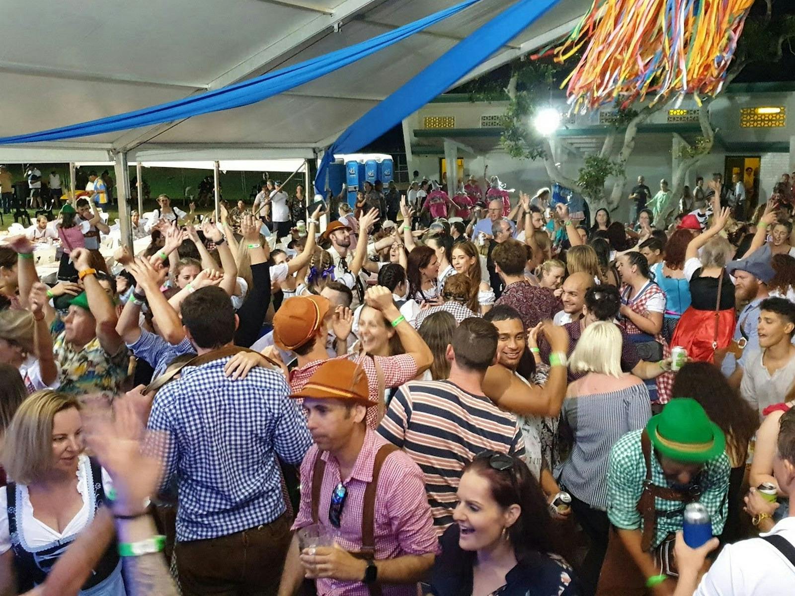 Crowd of patrons dancing and enjoying the music