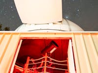 Inside the observatory showing the telescope and starry sky at the Chillagoe Observatory & Eco Lodge