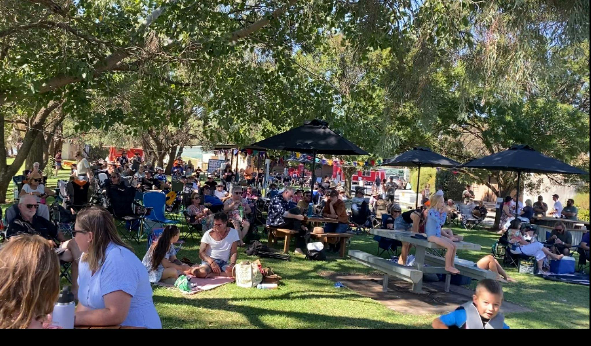A vibrant crowd fills the festival grounds