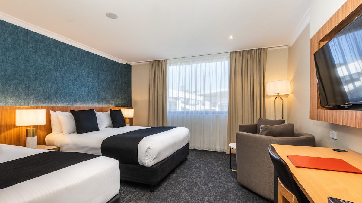 Deluxe Queen + Single Bedroom with Desk & sitting area