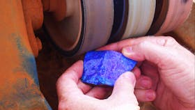 piece of opal being cut and polished