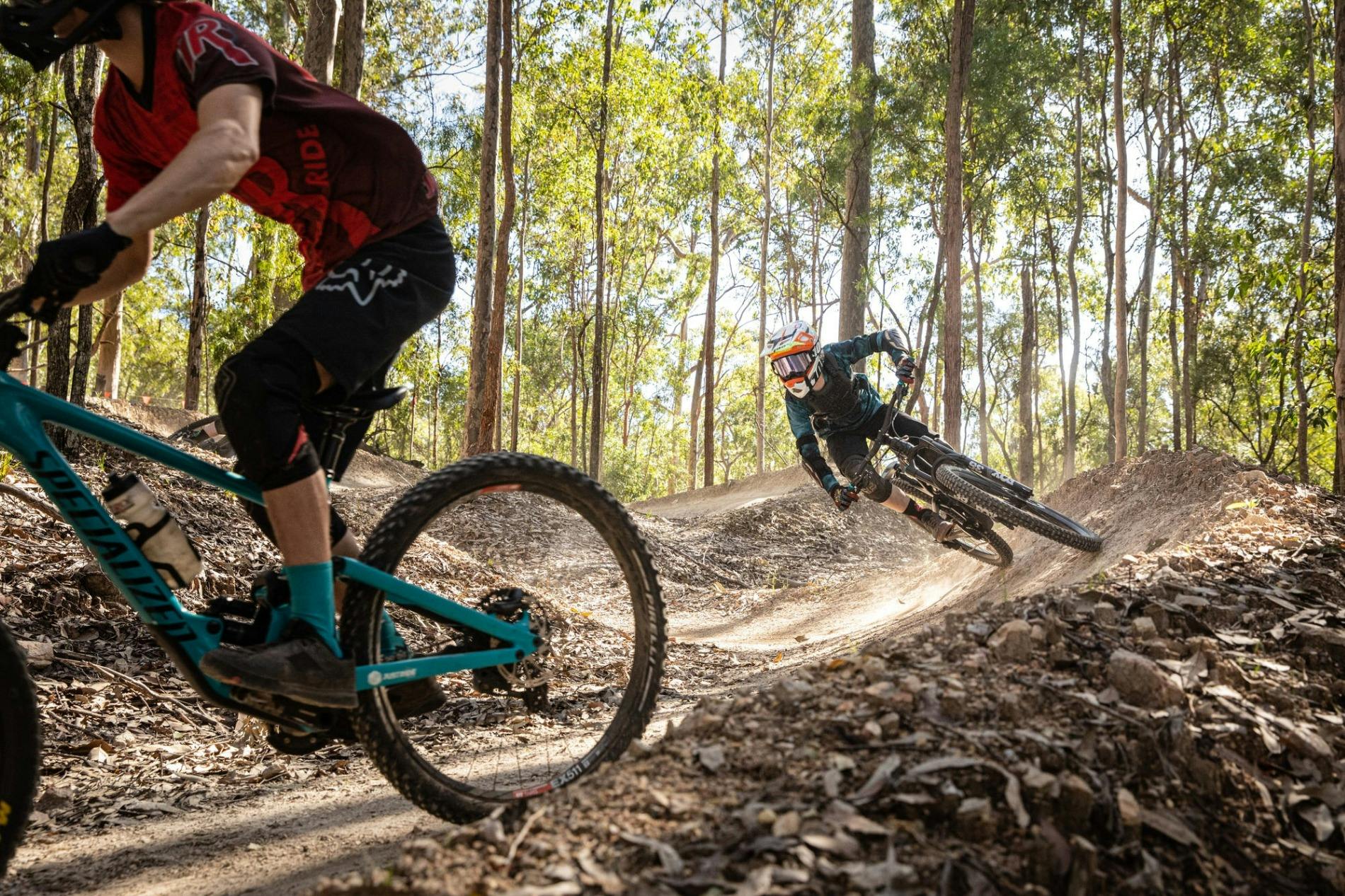 rider with safety gear on mountain bike