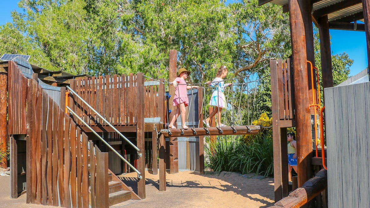 Two girls walking along the Plantation Nature Play