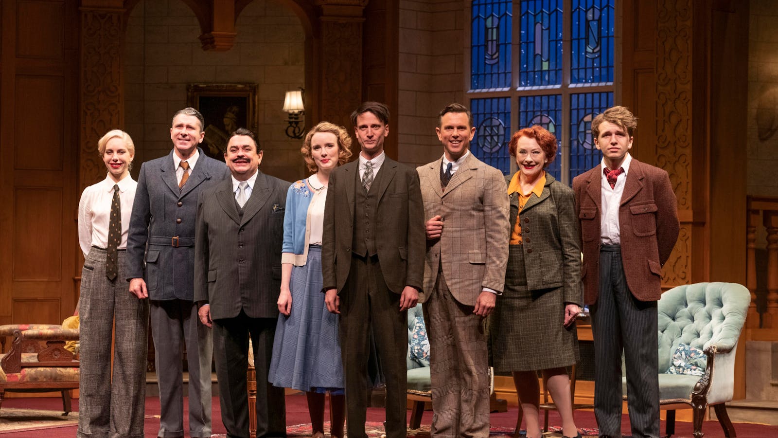 The cast of The Mousetrap stand on stage in a line. They look to the audience.