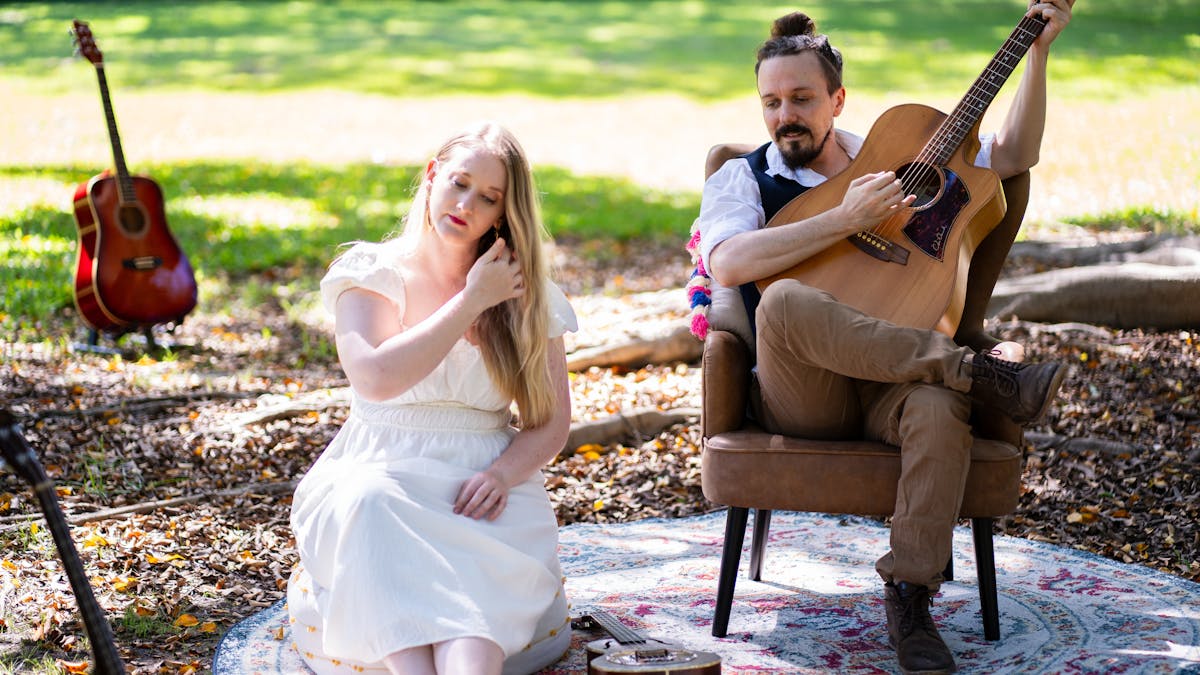 inkind promo Nate & Erin sitting on rug