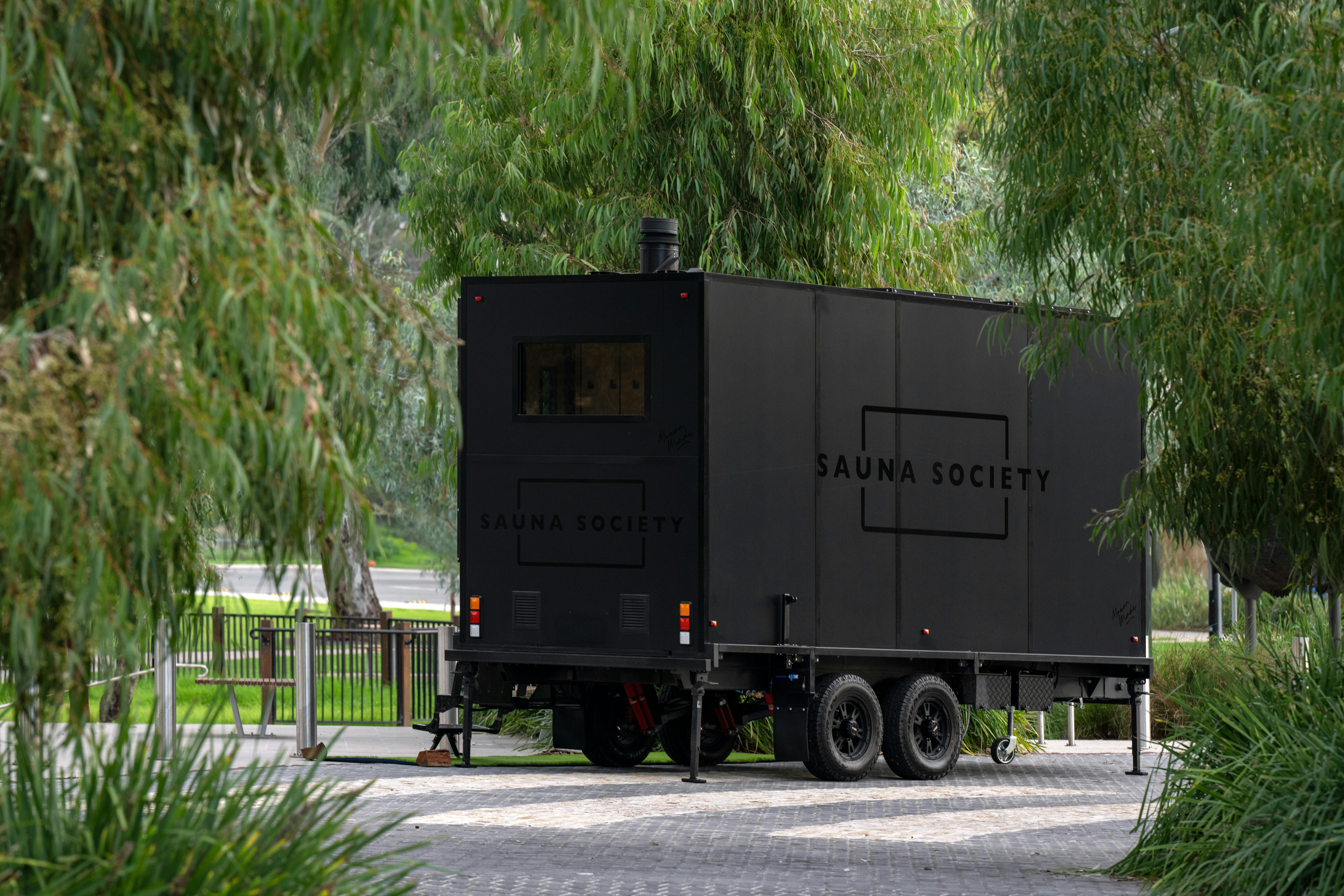 Image show sauna set close to river where it operates from.