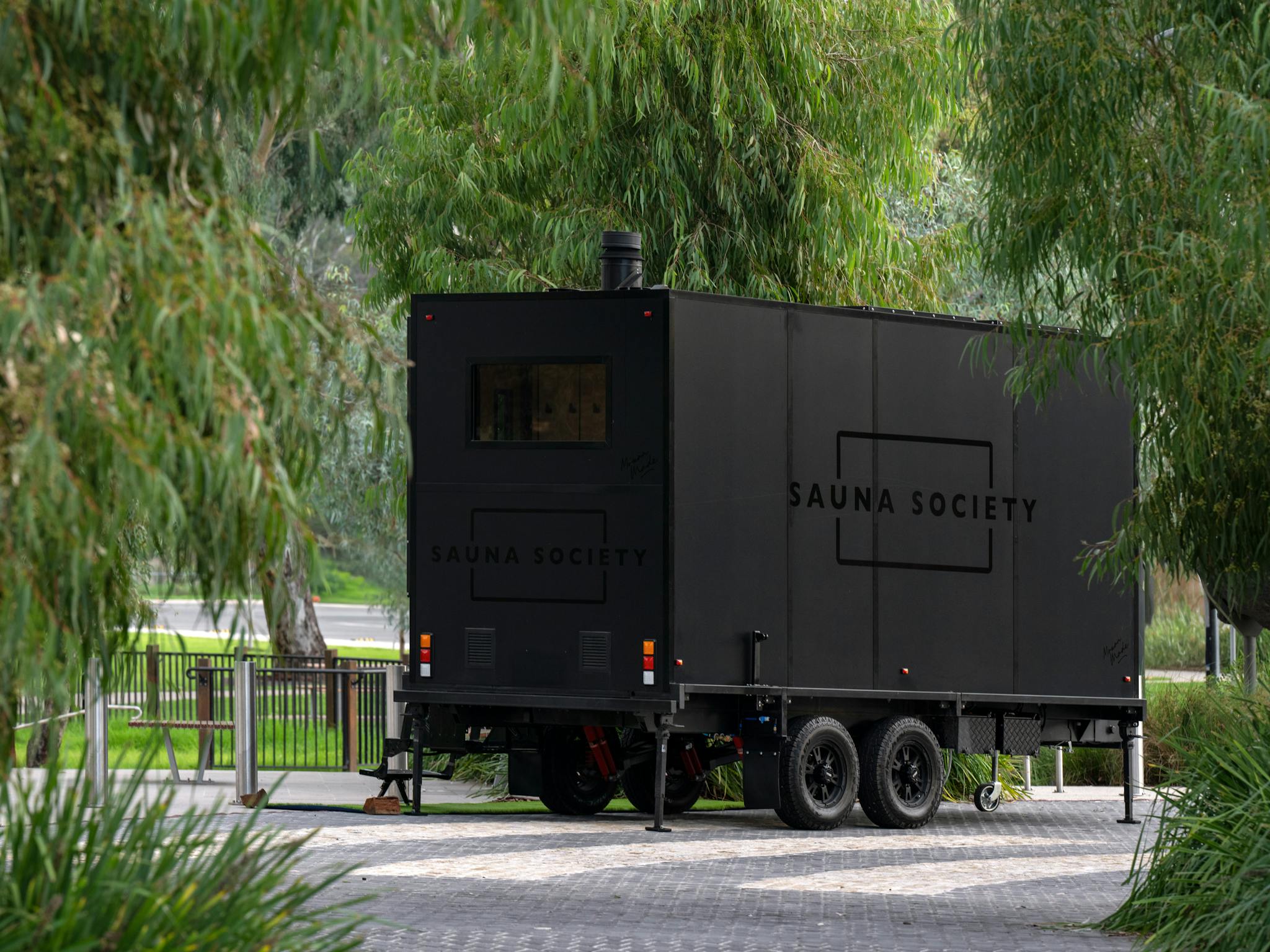 Image show sauna set close to river where it operates from.