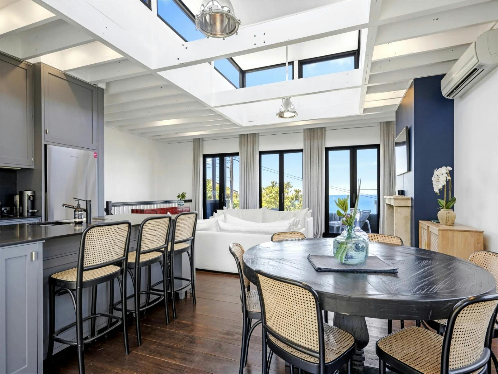 Inviting open plan dining, living, and kitchen areas seamlessly integrated