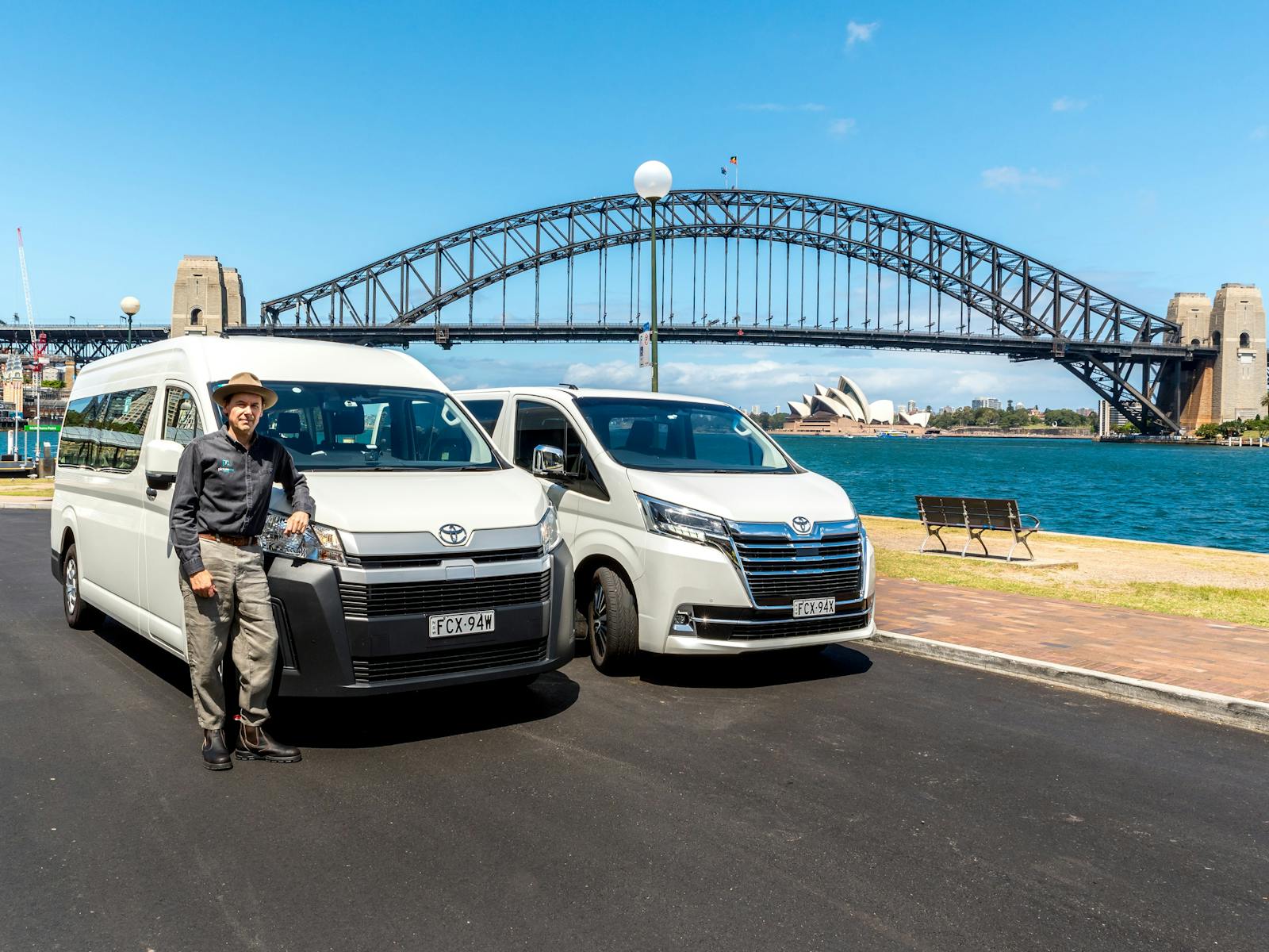 Two Picture Me Sydney vans in front of Sydney Harbour Bridge