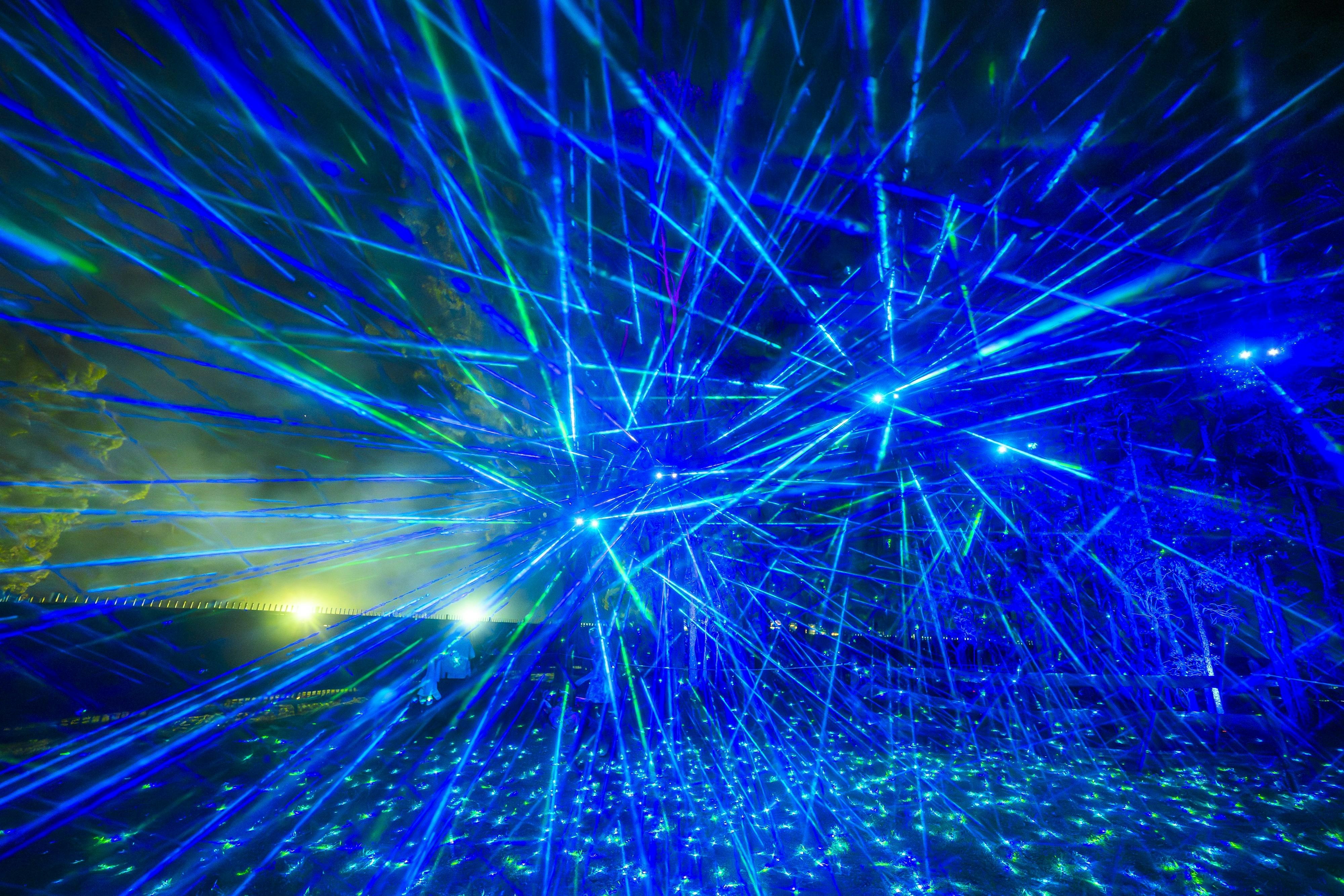 A field of blue star light lasers