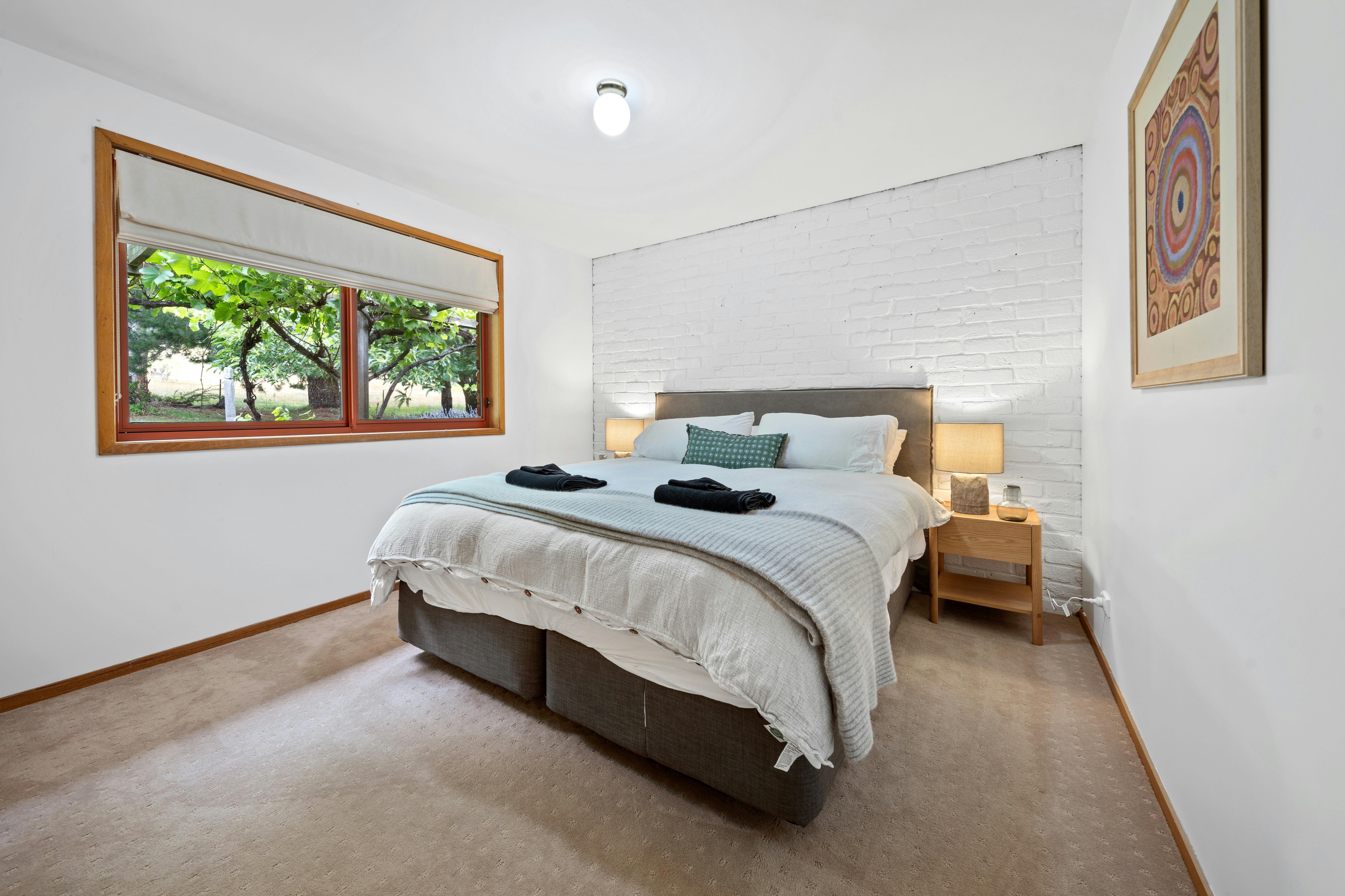 Three bedrooms include wardrobes and AH Beard king/king single beds with premium linens