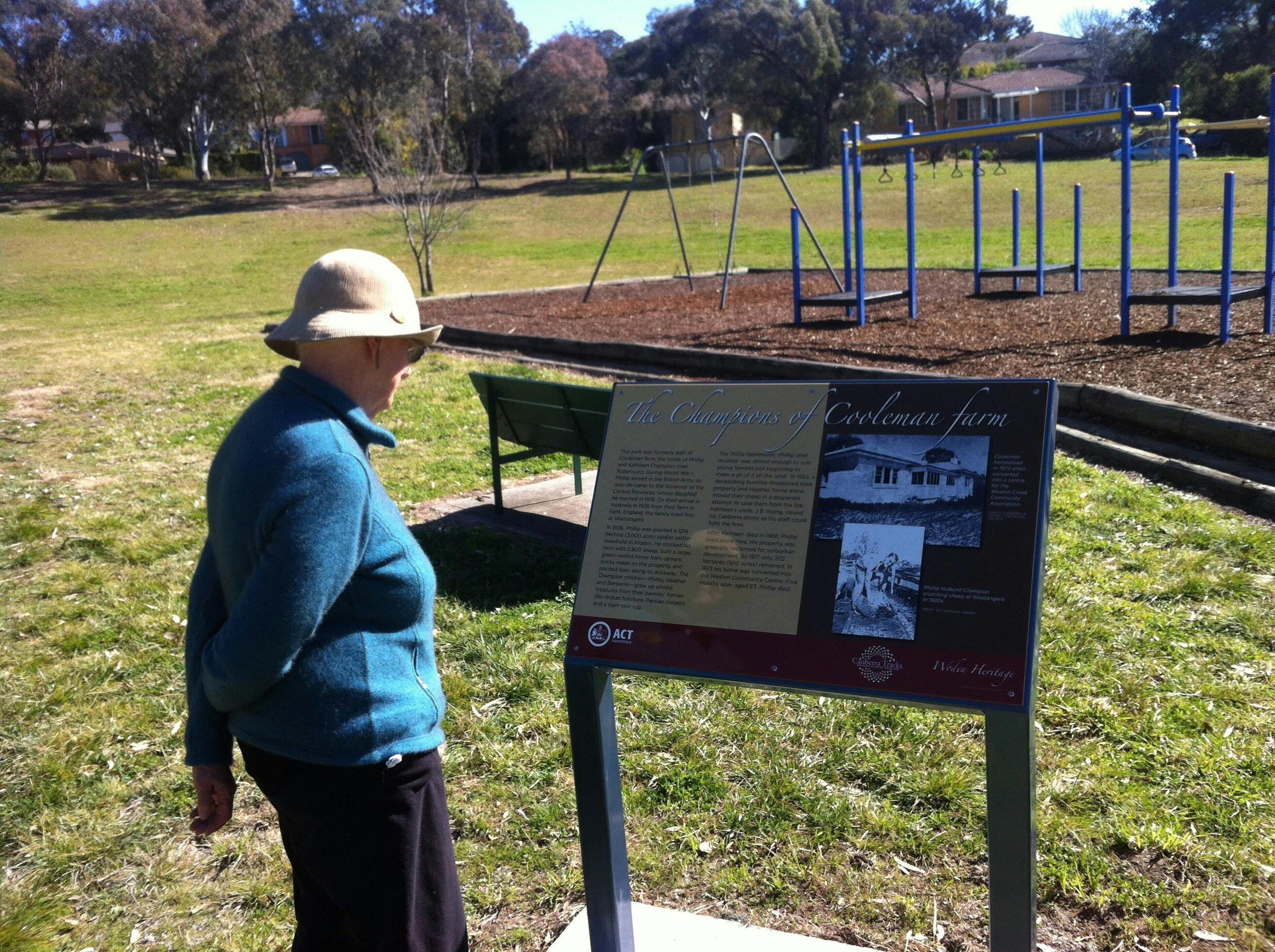 Woman reading sign in playground