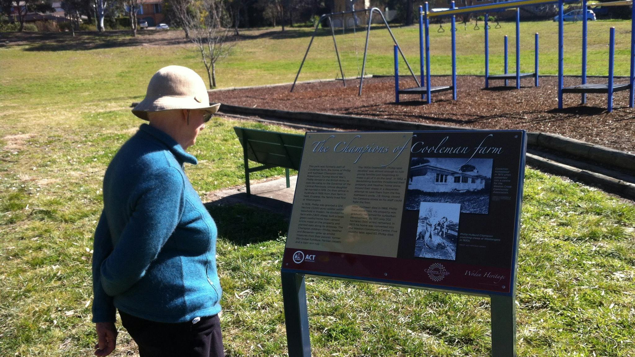 Woman reading sign in playground