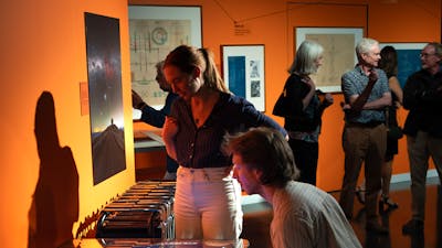 Visitors playing Guide Star, an arcade game made for the exhibition