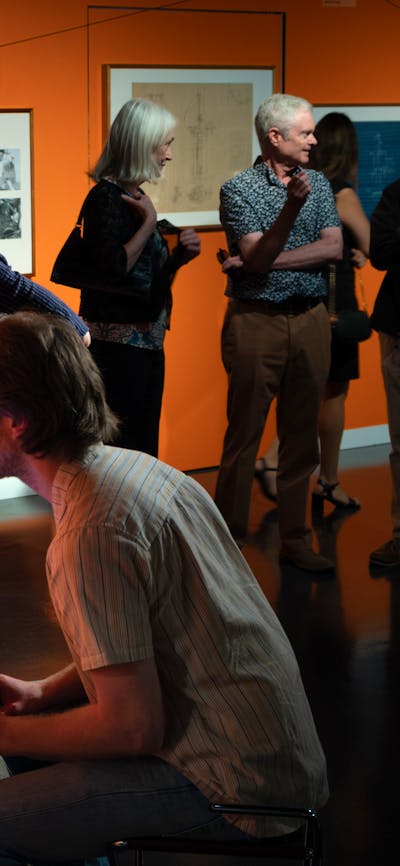 Visitors playing Guide Star, an arcade game made for the exhibition