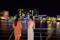 Ladies looking at city lights of Cairns
