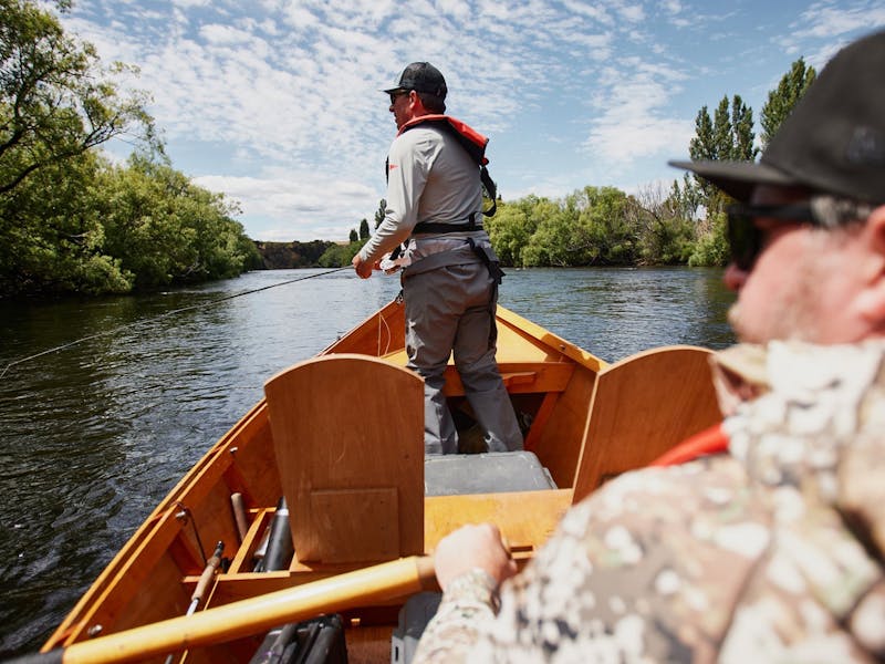 Guided fly fishing tour in a drift boat on a Tasmanian river