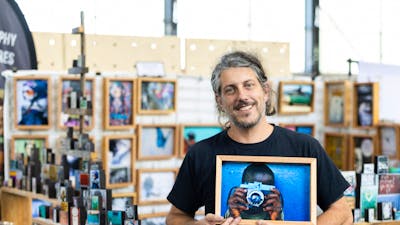 I Am Someone holding one of their photo blocks