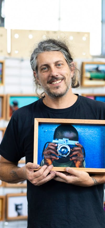 I Am Someone holding one of their photo blocks