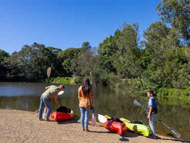 A family preparing to canoe the river A family preparing to canoe the river