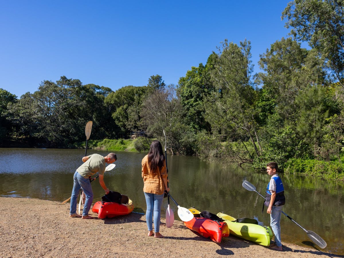 A family preparing to canoe the river