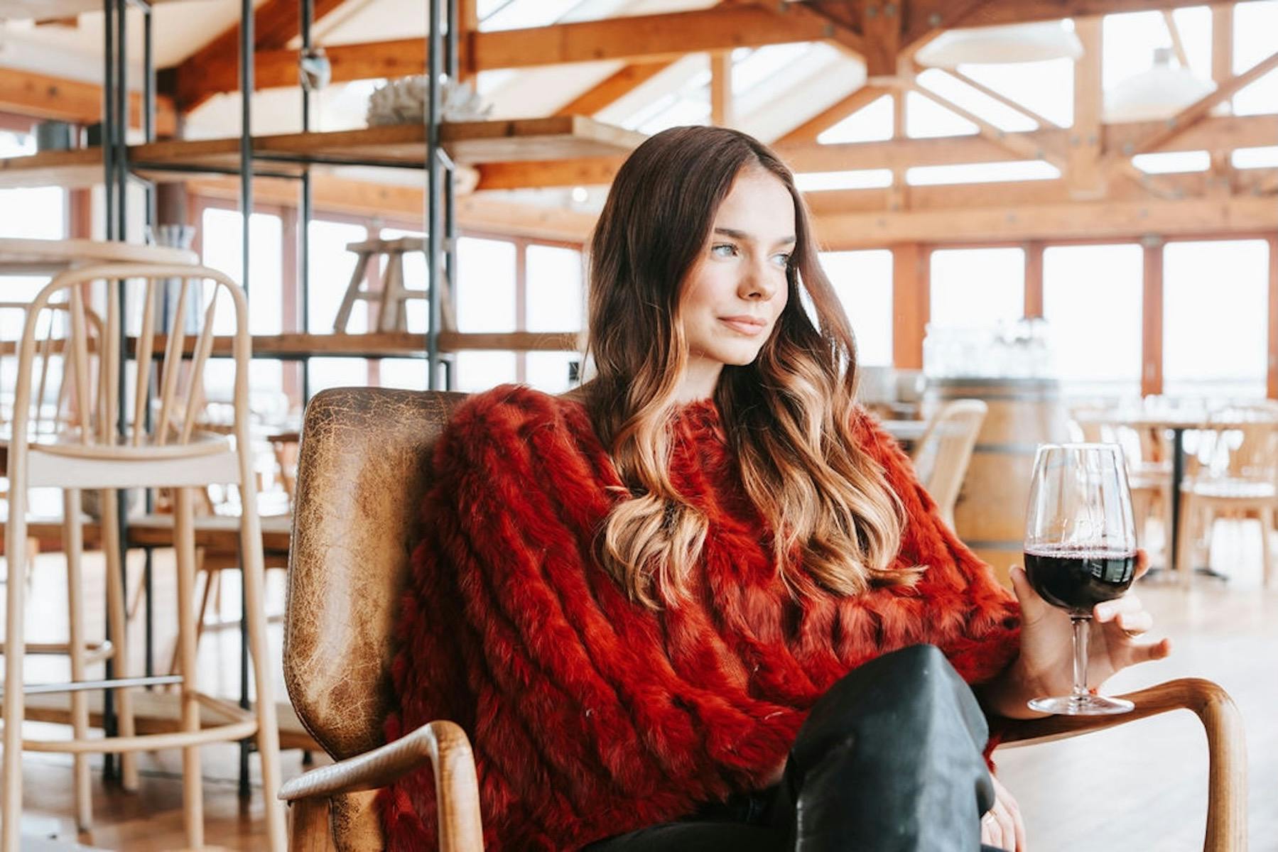 A woman wearing a fur poncho