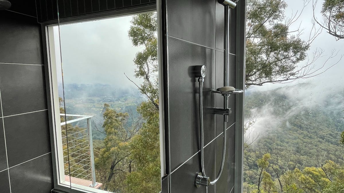 West House Upper bathroom with view reflected in mirror