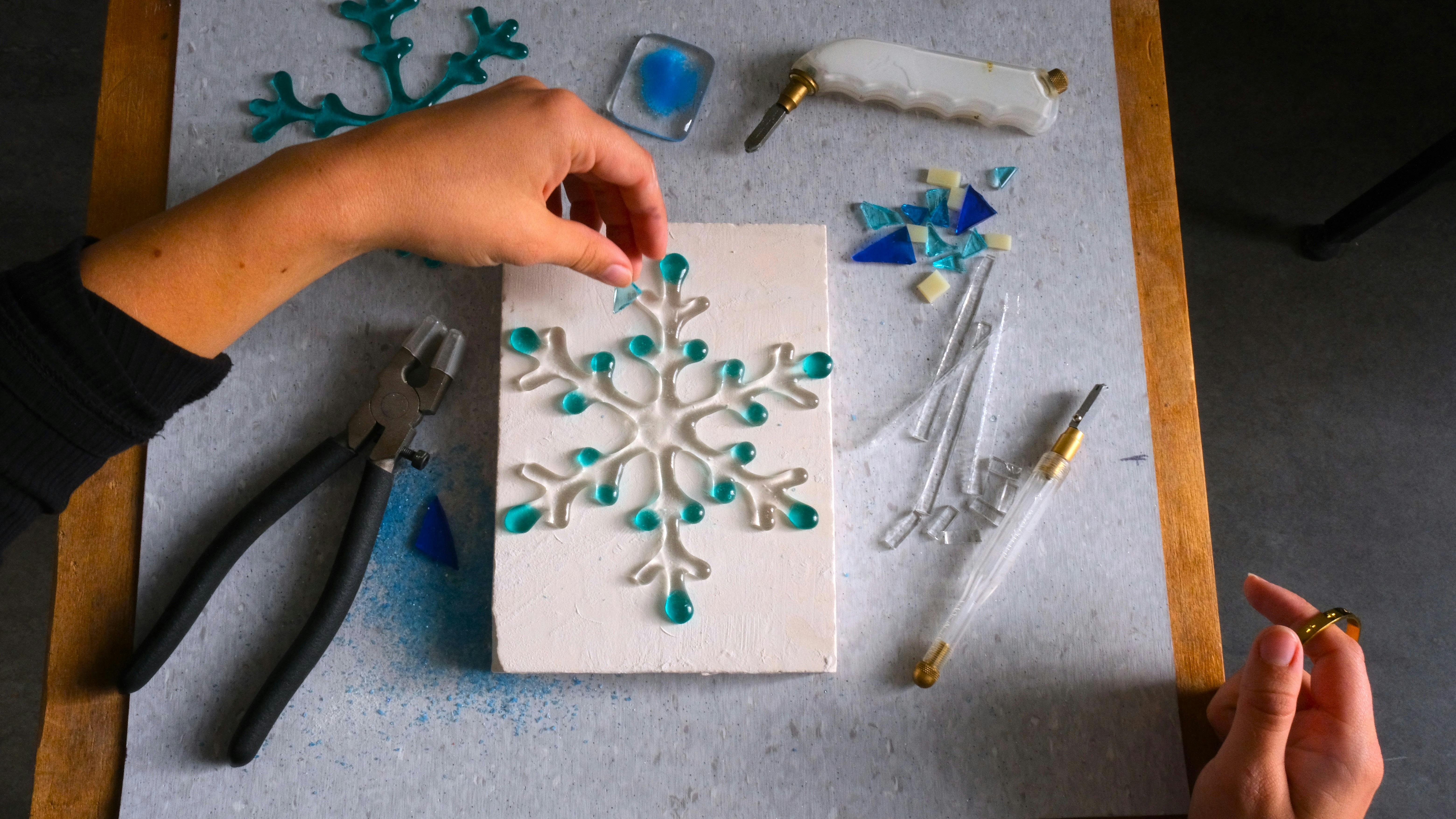 Hand arranging glass for kilnformed snow flake