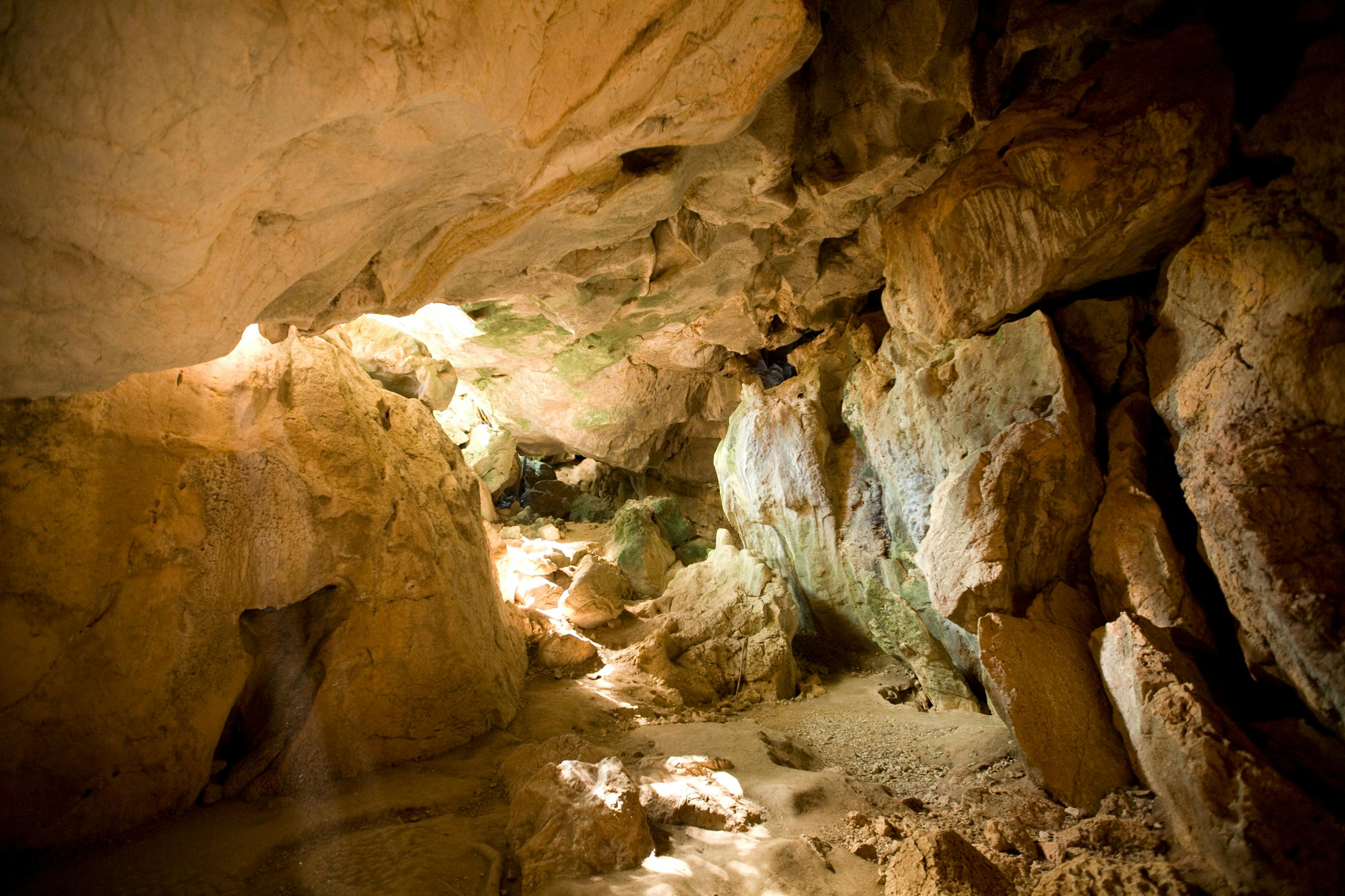 The sun shines through Cathedral Cave