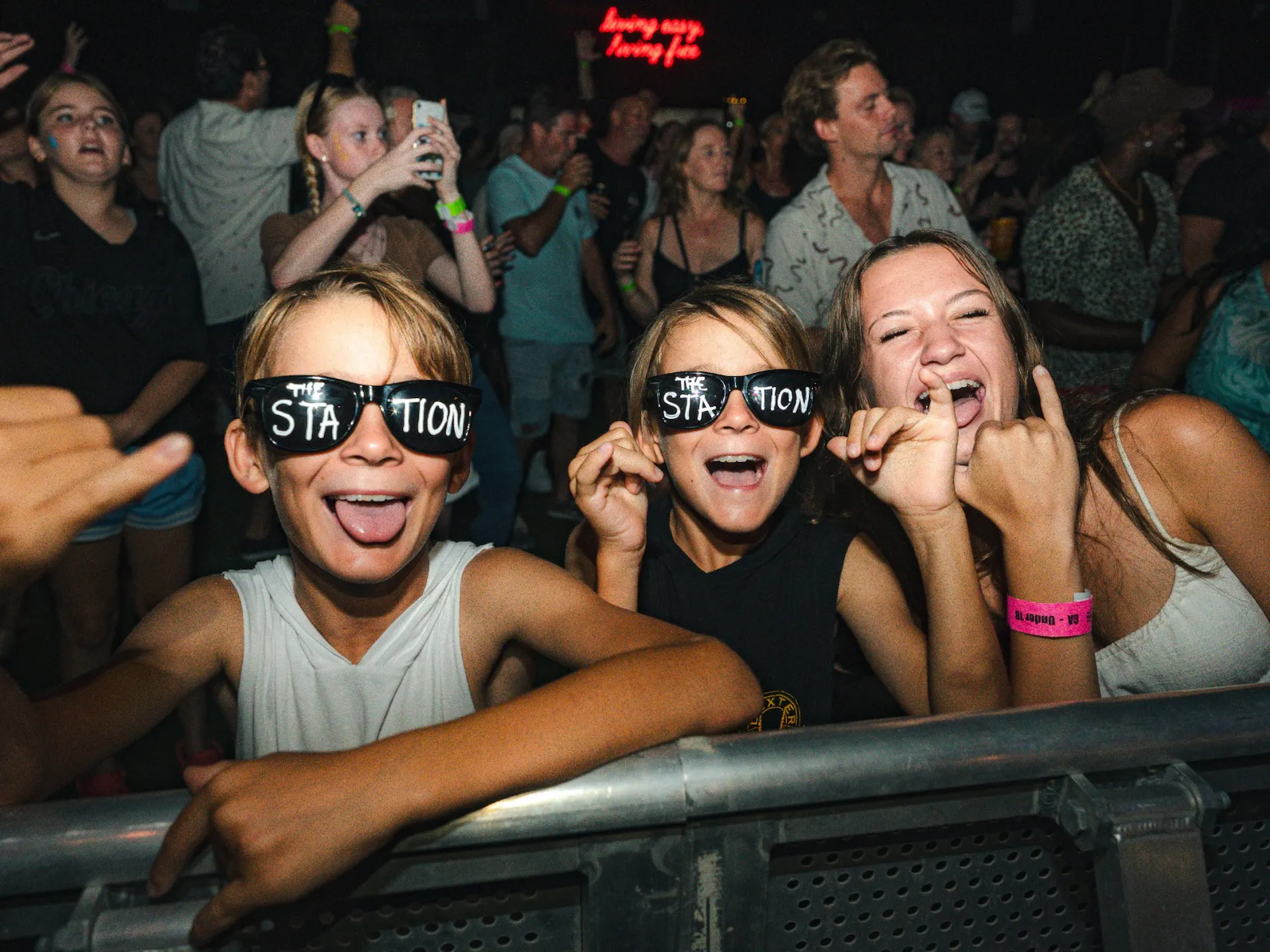 Kids wearing sunglasses, having fun and posing for a photo