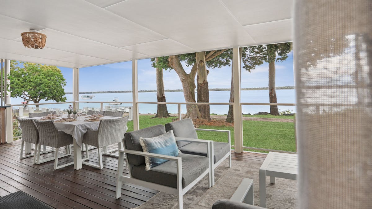 Covered veranda with river views