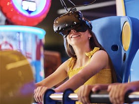 young person enjoying a game on a Virtual Reality ride