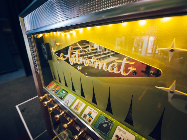 An art-o-mat machine (retired cigarette vending machine that have been converted to vend art.)