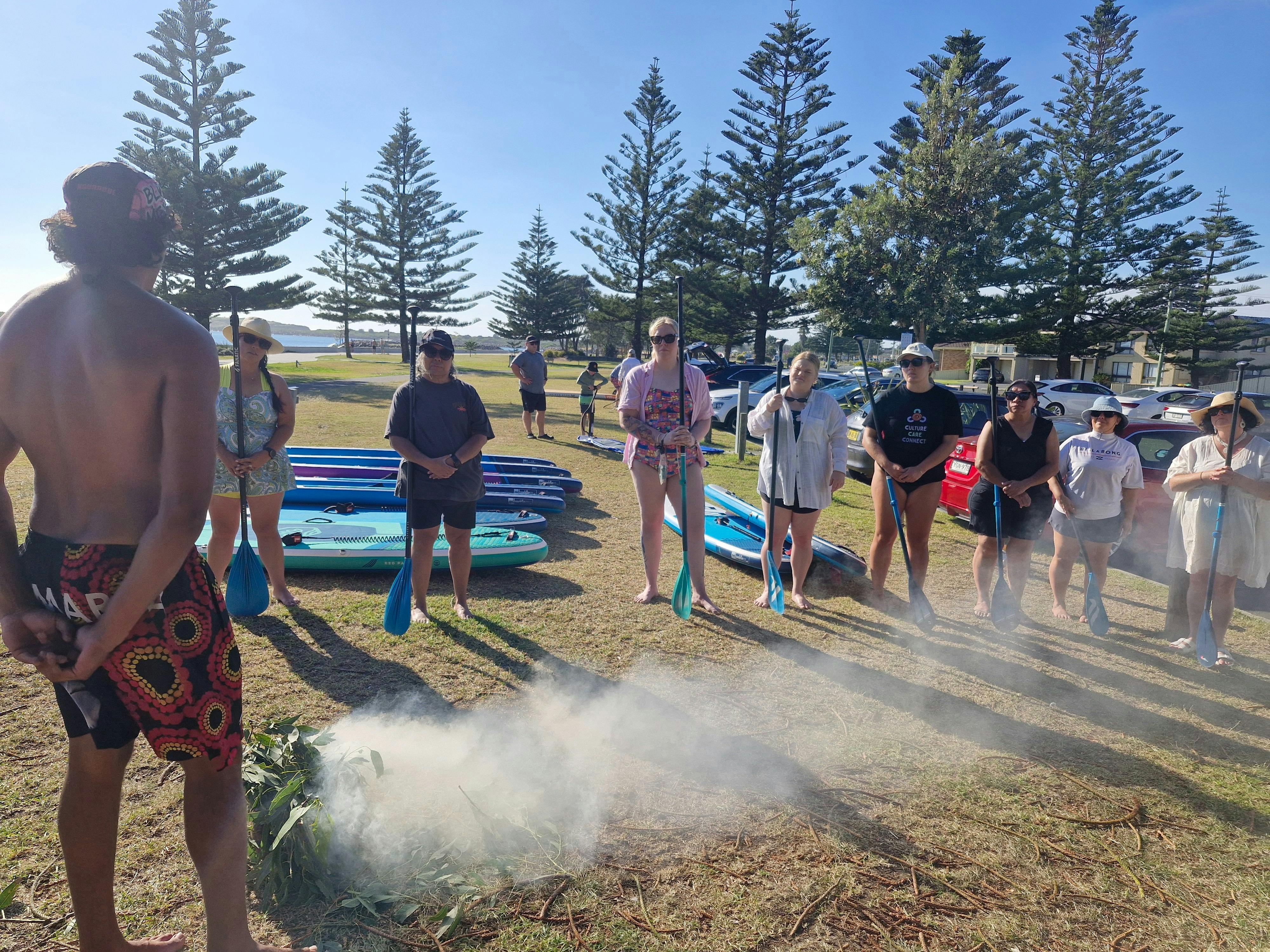 Sam from Gumaraa is welcoming the group with a smoking ceremony