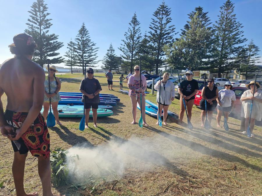 Sam from Gumaraa is welcoming the group with a smoking ceremony