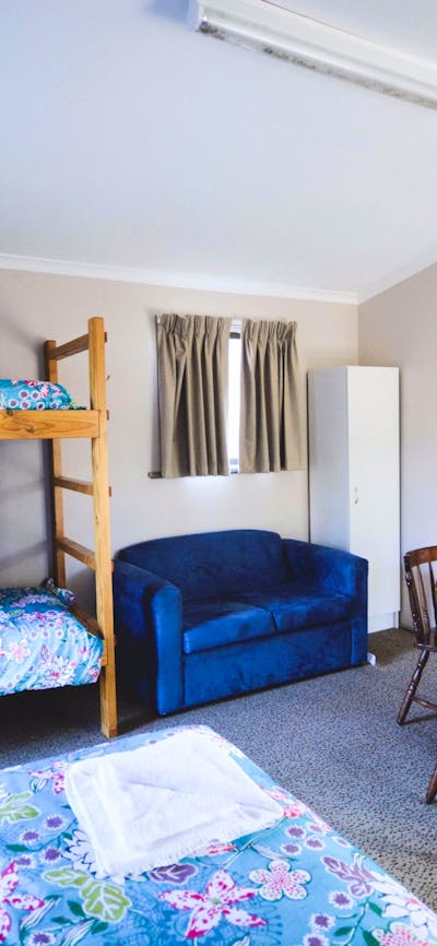 Christie Cabin interior with double bunks, double bed and kitchenette