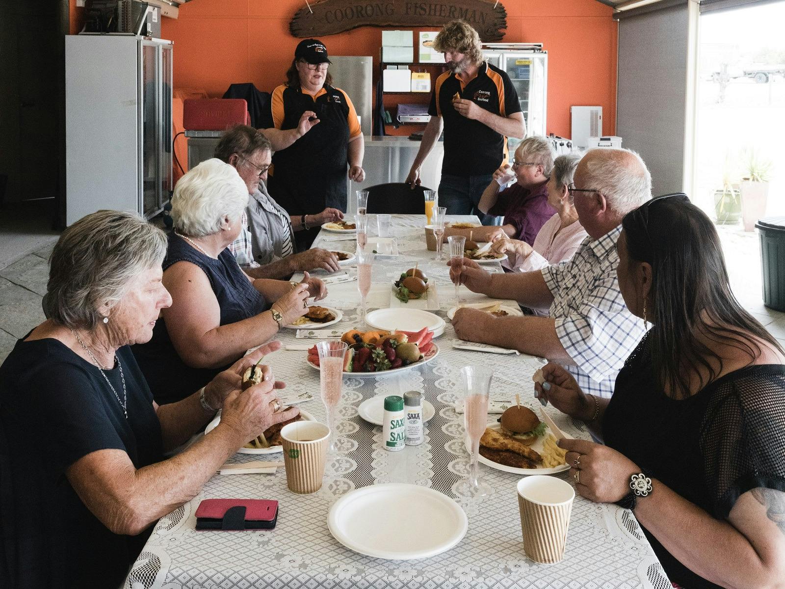 A tour group enjoying a seafood lunch at Coorong Wild Seafood