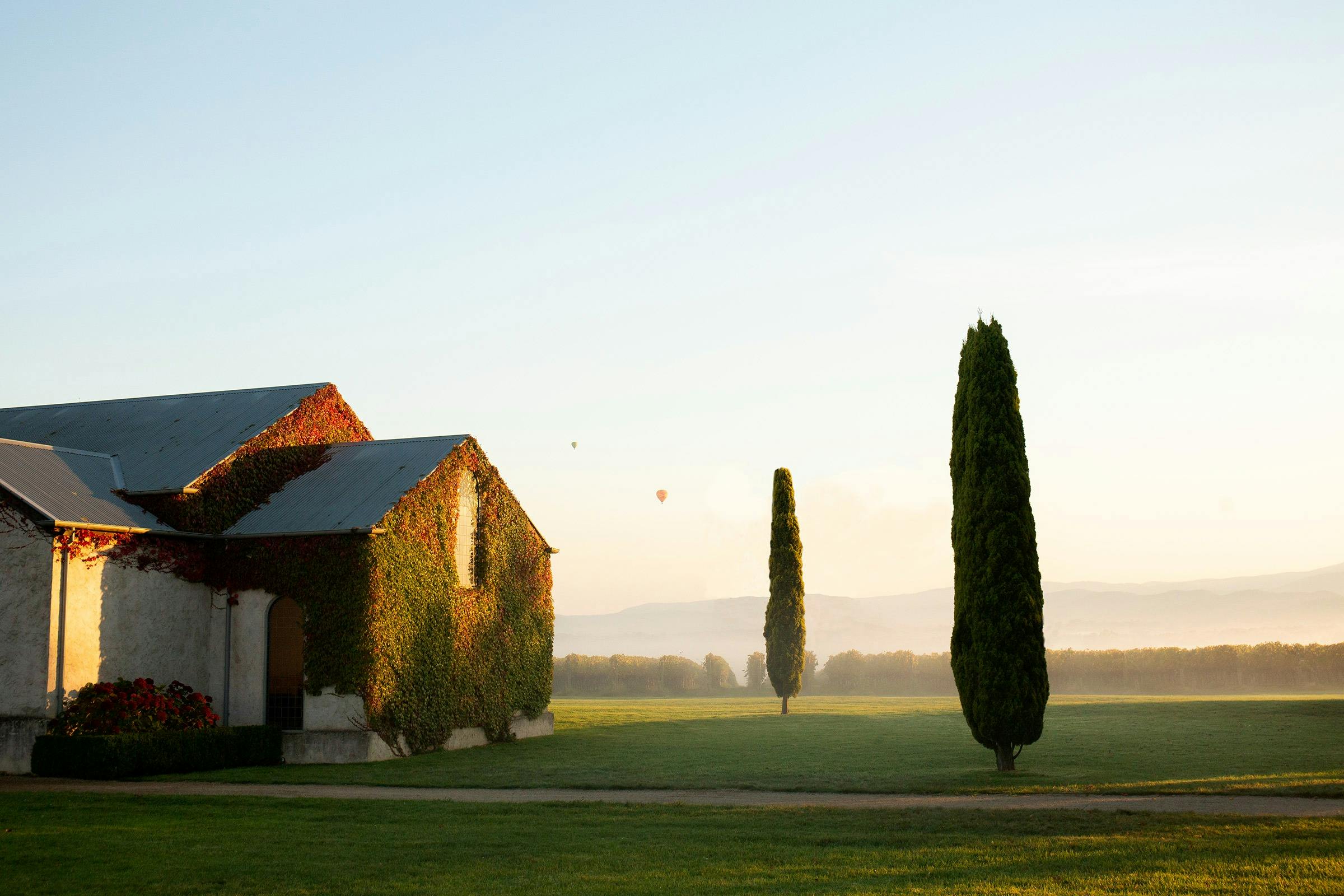 The Chapel with a sunrise view and hot air balloons in the distance