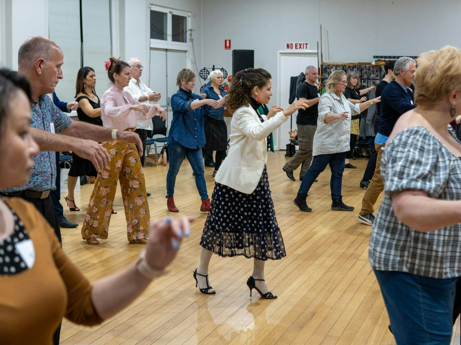 Tango bootcamp session showing dancers practicing