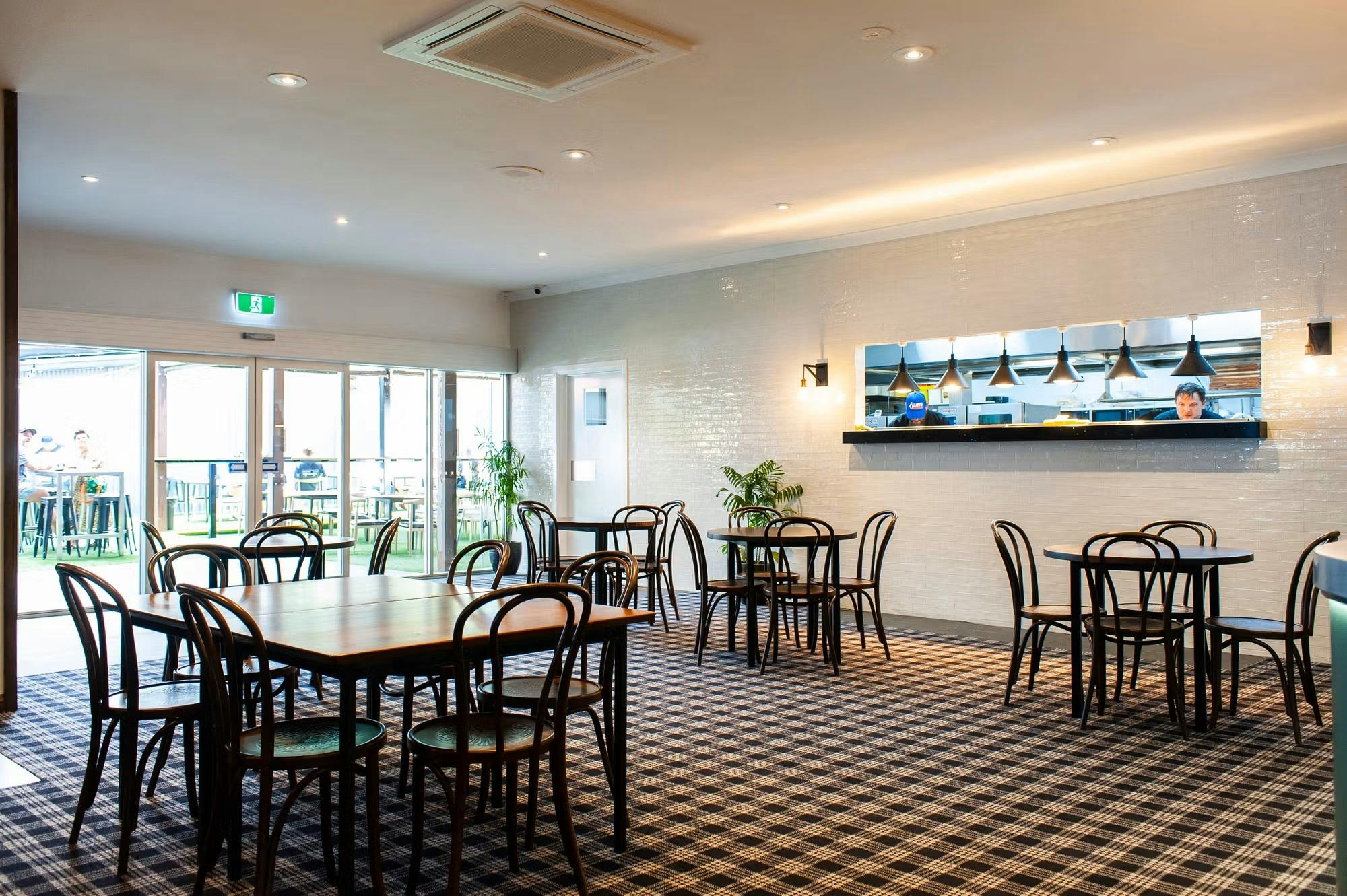 Indoor seating area facing the pass for the kitchen