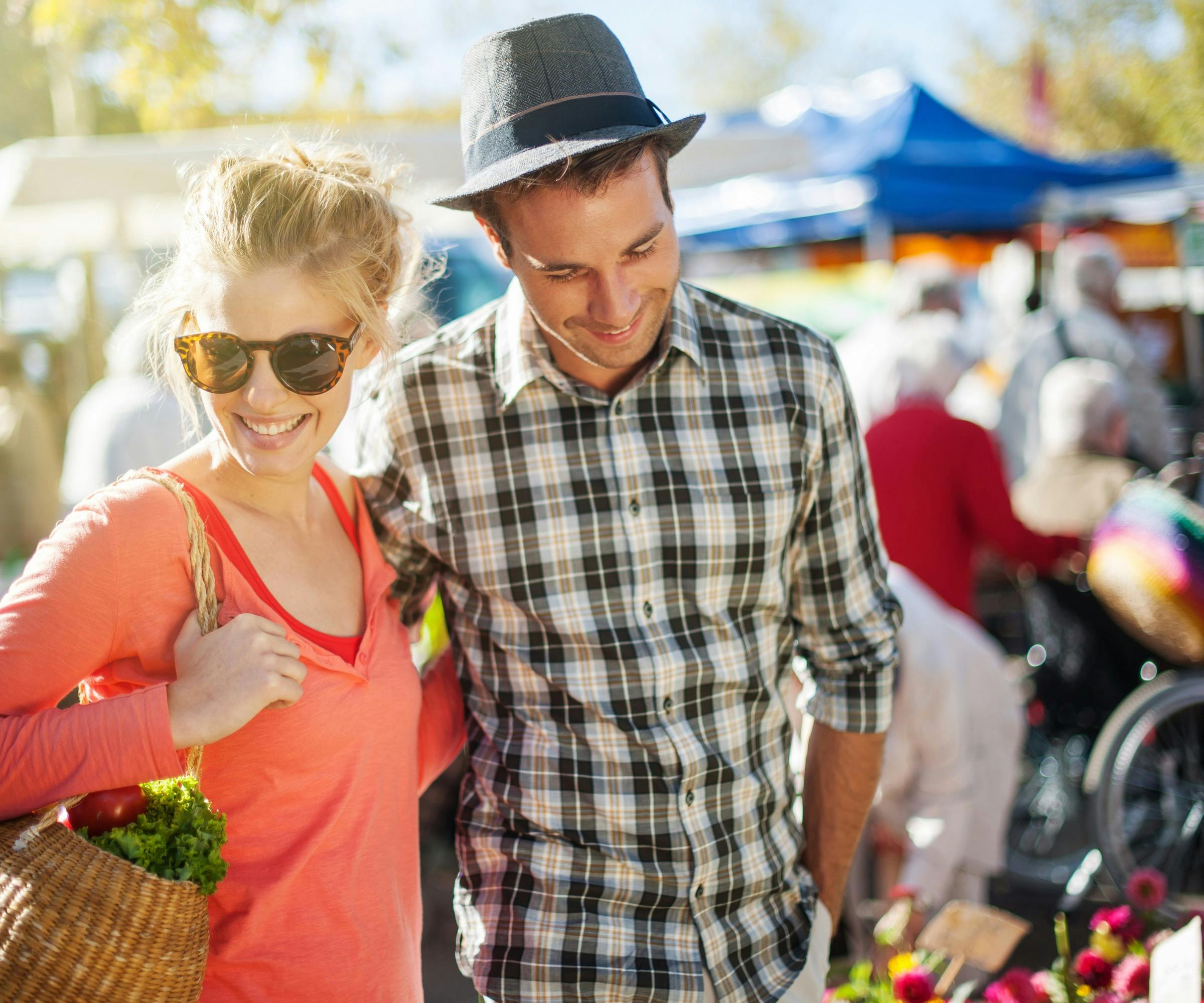 A happy couple shopping together at a market.