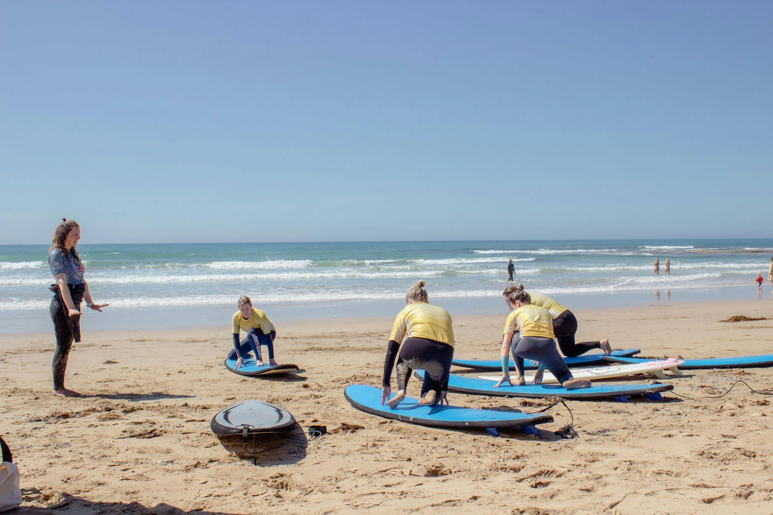 A beginners group learning the technique on the beach before heading out.