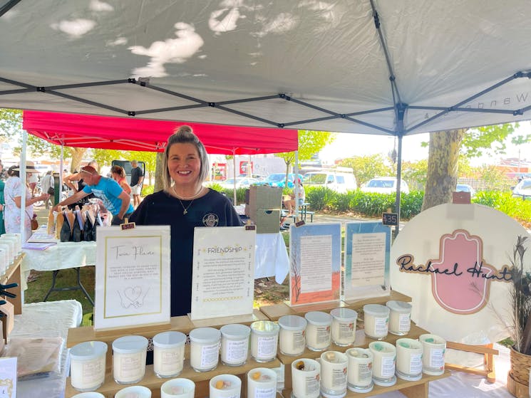 woman behind candles stall