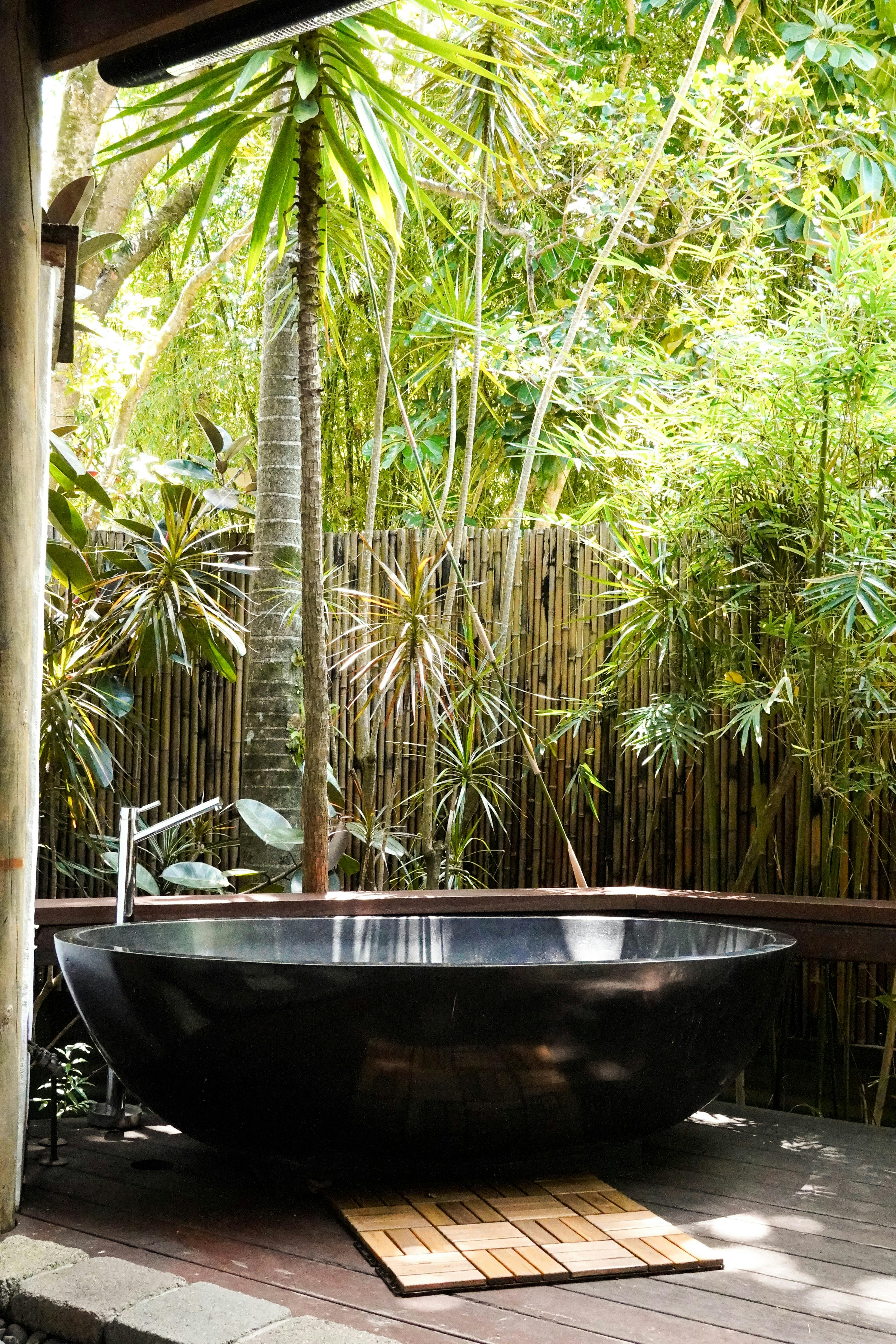 Private outdoor bath under the stars surrounded by tropical gardens at Dragonfly's Rest Byron Bay.