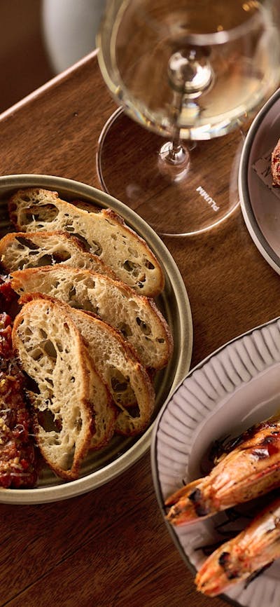 Beef Tartare + Gochujang + Sourdough Cracker, Yamba King Prawn + Aleppo Pepper, Flo's Potato Gems