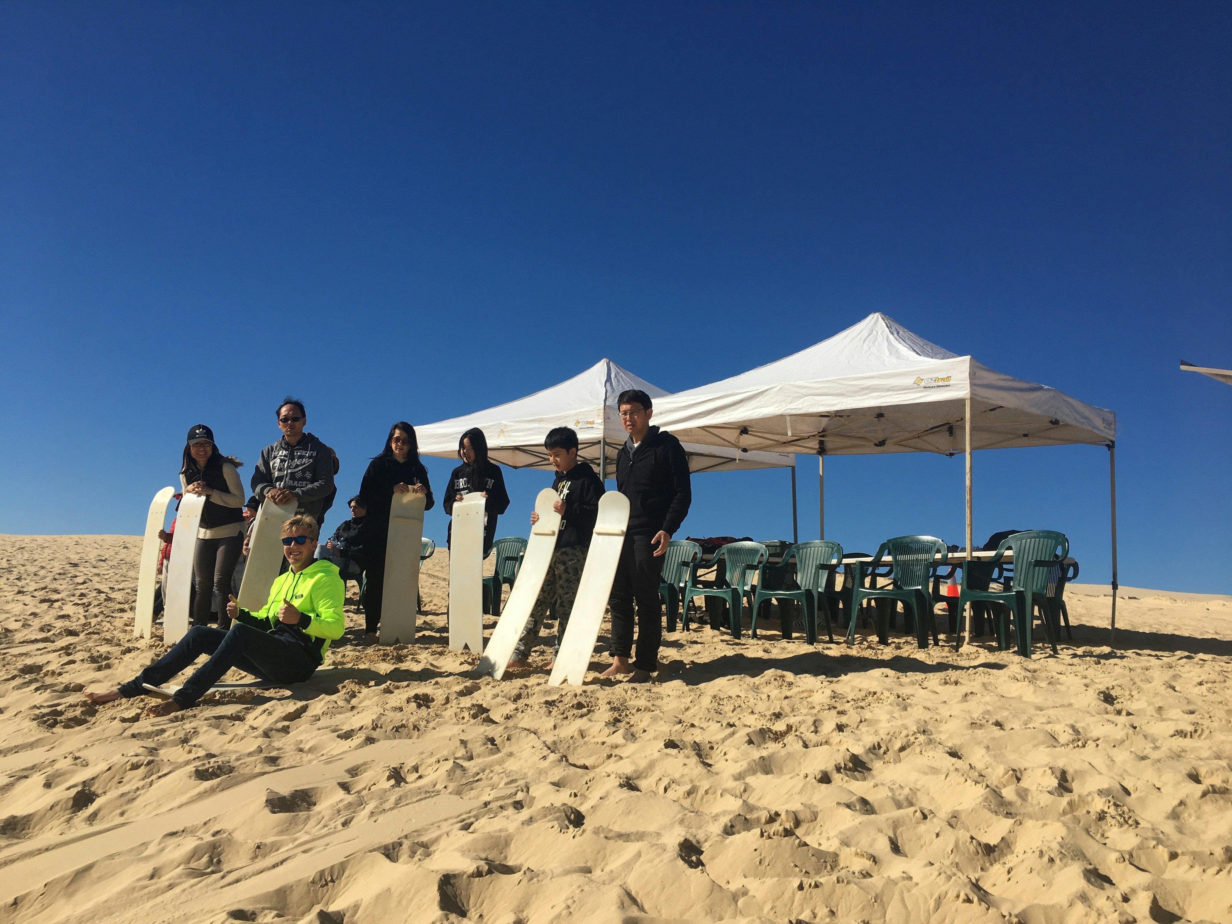 One of our instructors showing a family how its done, with our awesome picnic area in the background