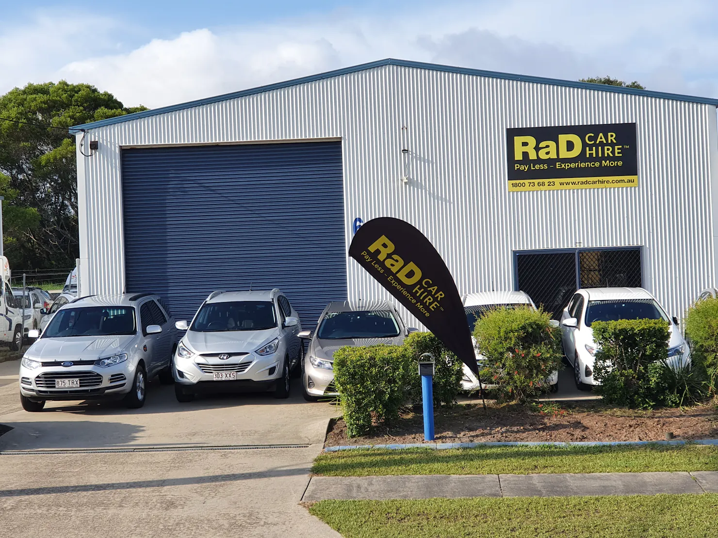 RaD Car Hire depot with rental cars parked