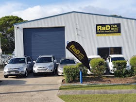 RaD Car Hire depot with rental cars parked